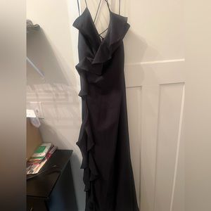 Navy blue maxi dress. Ruffled and strappy in the back. Slit up the front